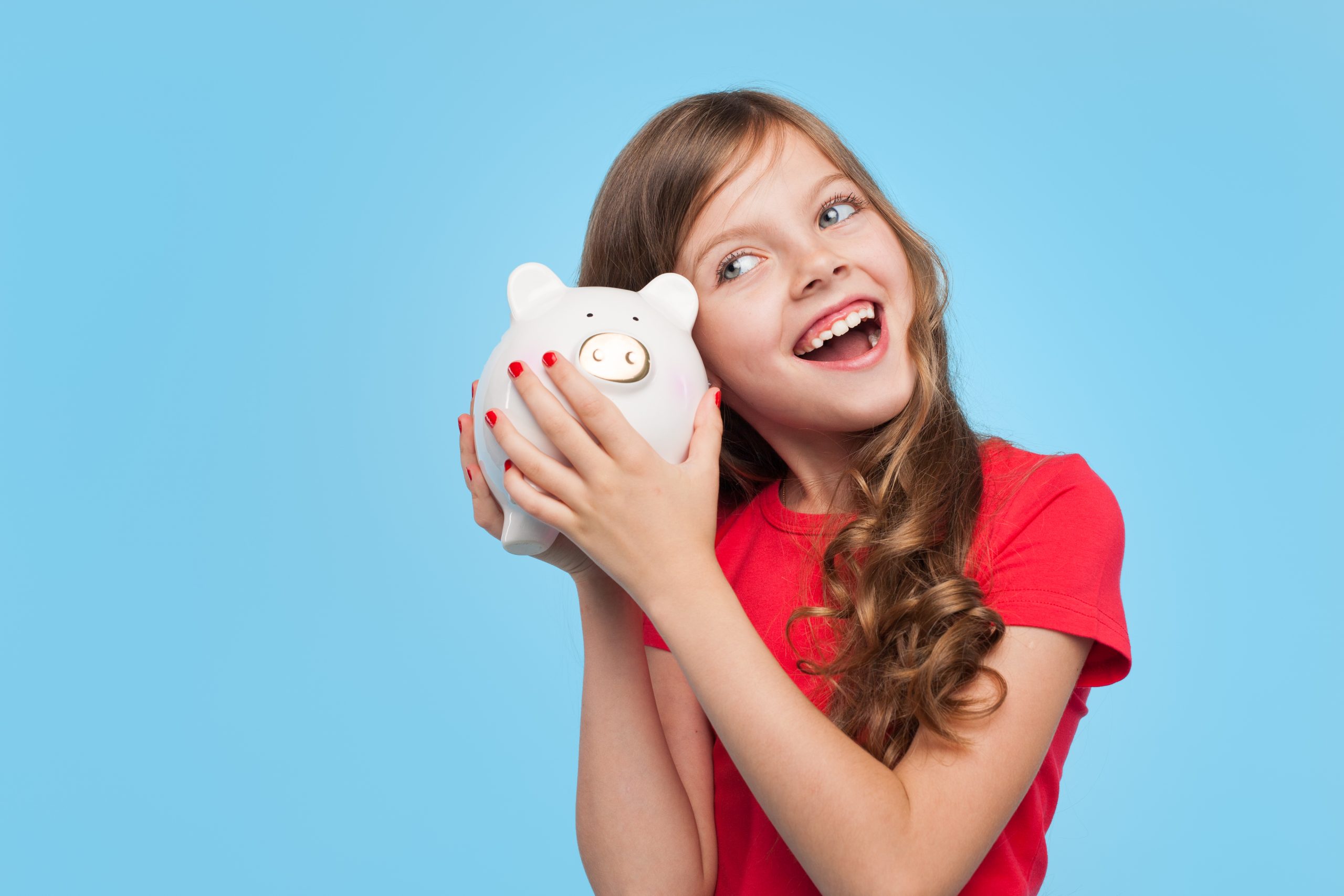 Child with a piggy bank wondering what a Junior ISA is